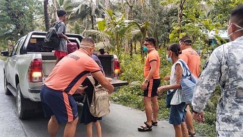 Members of the Coast Guard Station in Sorsogon are assisting residents in evacuating following the eruption of Mt. Bulusan. The evacuees are brought to the MMDRMO center in Barangay Tughan on Monday morning.