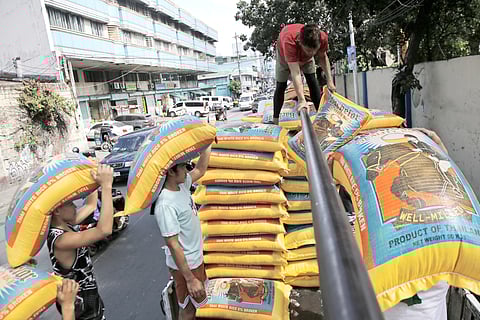 Rice aplenty? Yes, if you can afford imported rice like those being loaded by workers into a truck along Dagupan Street in Tondo, Manila, on Monday.