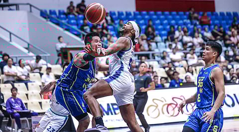 ROGER Pogoy and the TNT Tropang 5G struggle to stop Schonny Winston and the Converge FiberXers during their PBA Philippine Cup game last Sunday.