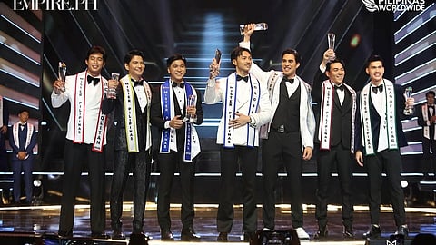 The newly crowned Mister Pilipinas Worldwide 2025 titleholders celebrate on stage, each holding a trophy and wearing their respective sashes, including Kirk Bondad who will represent the Philippines in Thailand for Mister Pilipinas International.