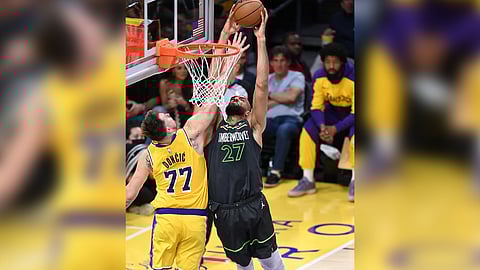 Rudy Gobert serves as a tower of power, lifting the Minnesota Timberwolves to a 103-96 win over the Los Angeles Lakers to advance to the second round of the NBA Western Conference playoffs series.