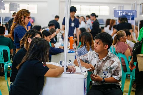 Job seekers troop to Manila Science High School in Ermita, Manila, on 01 May 2025, where almost 10,000 vacancies are being offered across various industries such as business process outsourcing (BPO), wholesale and retail trade, construction, and manufacturing (TOTO LOZANO)
