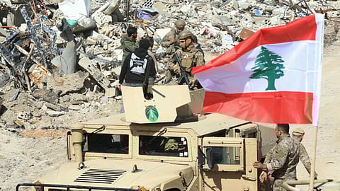 Lebanese army troops patrol the destroyed southern border village of Adaisseh, following the Israeli forces withdrawal on February 18, 2025.