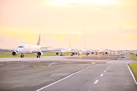 Runway rest Birds of steel from various airline fleets lie in wait for their assigned moment to take off under the midday sun at the Ninoy Aquino International Airport.