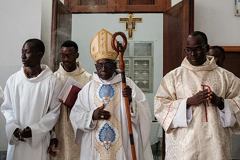 (FILES) Guinean cardinal Robert Sarah (C) attends a prayer at the Cathedral of Our Lady of Victories in Dakar on December 4, 2023.