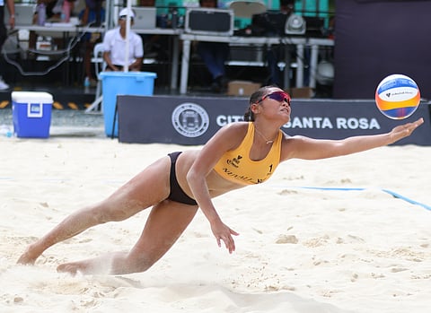 Khylem Progella tries to save the ball during their Volleyball World Beach Pro Tour Futures Nuvali at the Nuvali Sand Courts in Santa Rosa, Laguna. Progella and her partner, Sofie Paraga, won over Danieke Prins and Annemieke Driessen of the Netherlands, 23-25, 21-11, 15-10.