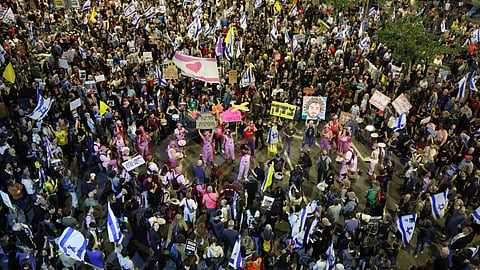 Israelis demonstrate outside the defence ministry in Tel Aviv on Saturday demanding action by the government to bring home the remaining hostages.