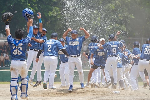 The NU Bulldogs celebrate after winning the Season 87 UAAP men’s baseball title yesterday at the Rizal Memorial baseball field.