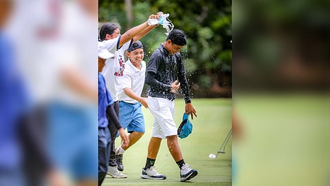 Ralph Batican gets a victory shower after ruling the 11-14 boys’ division of the ICTSI Mactan Island Junior PGT Championship on Tuesday.
