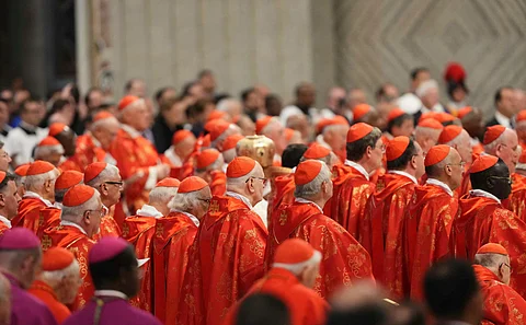 Cardinals attend a mass for the Election of the Roman Pontiff, prior to the start of the conclave, at St Peter's Basilica in The Vatican, on 7 May 2025.