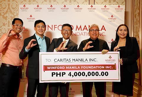 In photo (L-R) John Rocky Leona, Assistant Director for Finance; Darwin Cusi, VP Gaming Operations; Jeff Evora, President & COO; Fr. Antonio Pascual, Executive Director Caritas Manila; and Sab San Pedro, Director for Marketing.