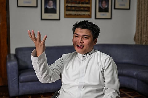 SEMINARIAN Neil Pena is interviewed at the University of Santo Tomas Central Seminary in Manila.