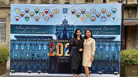 The author (left) and her mother (right), Mai, shares a quiet triumph on graduation day.