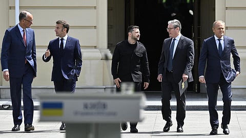 (From L) Germany's Chancellor Friedrich Merz, France's President Emmanuel Macron, Ukraine's President Volodymyr Zelensky, Britain's Prime Minister Keir Starmer and Poland's Prime Minister Donald Tusk arrive to a press conference after their meeting in the capital Kyiv on May 10, 2025.