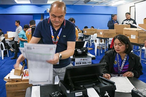 Commission on Elections (COMELEC) personnel conduct final testing and sealing of Automated Counting Machines (ACMs) at the Bureau of Treasury Convention Hall in Palacio del Gobernador, Intramuros, Manila. The 100 ACMs will be used for the mass feeding of the local absentee voting ballots.