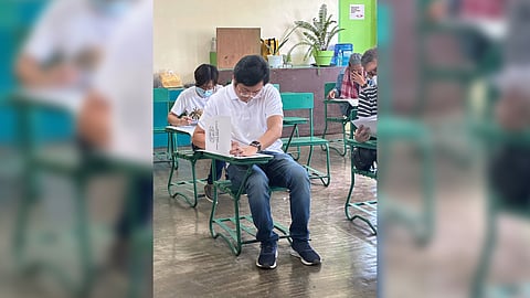 MAYORAL candidate Karlo Nograles casts his vote at the Teodoro Palma Gil Elementary School.