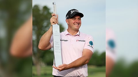 Sepp Straka displays the trophy after ruling the Truist Championship at Philadelphia Cricket Club on Sunday.