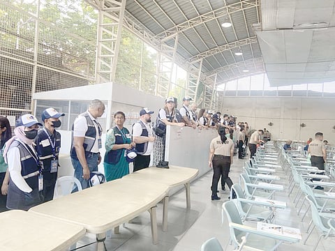 Foreign observers arrive at the New Bilibid Prison in Muntinlupa on Monday to monitor the penitentiary’s special polling precinct. Data from the Bureau of Corrections shows 4,125 persons deprived of liberty are eligible to vote.