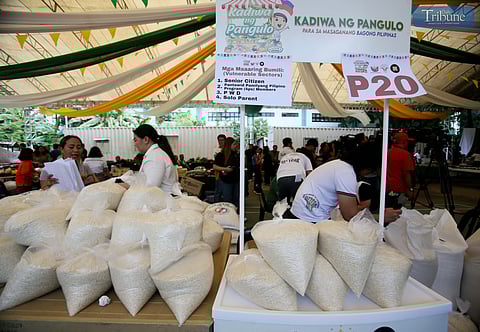 Plastic bags filled with rice are displayed under a tent at the Kadiwa ng Pangulo center in the Bureau of Animal Industry compound, Quezon City, where members of vulnerable sectors can purchase rice at P20 per kilo as part of the government’s subsidy program.