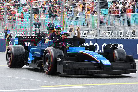 CARLOS Sainz Jr. shares a laugh from the paddock as FIA presidency talk swirls around his rally legend dad.