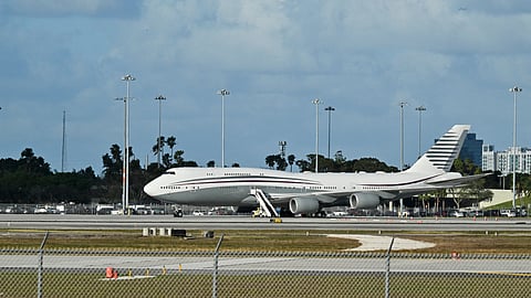 A Qatari Boeing 747 jumbo jet sits on the tarmac at Palm Beach International Airport on 15 February 2025, after US President Donald Trump toured the aircraft. The luxury jet, offered by Qatar’s royal family, has drawn controversy over plans to use it as Air Force One.