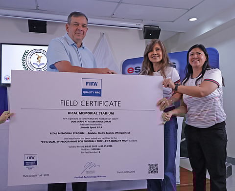 PSC chairman Richard ‘Dickie’ Bachmann (left) displays a copy of the FIFA Quality Pro field certificate during the PSA Forum last Tuesday. Also shown are E-Sports International managing director Audris Romuladez and general Manager Pam Romualdez.
