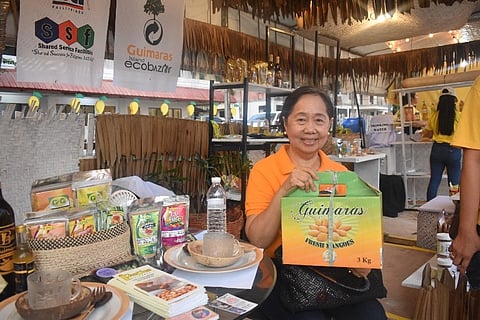 A seller shows a Guimaras mango by-product during the International Food Exhibition Philippines from 22 to 24 May at the World Trade Center in Pasay City.