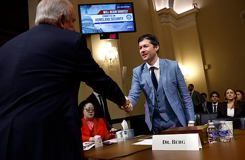 Rep. Carlos Gimenez (R-FL) greets Ryan Berg, Director of the Americas Program and head of the Future of Venezuela Initiative at the Center for Strategic and International Studies, during a House Committee on Homeland Security subcommittee hearing in the Canon House Office Building on May 06, 2025 in Washington, DC.