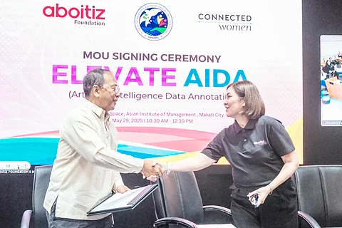 Aboitiz Foundation Inc. president Ginggay Hontiveros-Malvar (right) and Office of the Presidential Adviser on Peace, Reconciliation and Unity head and Presidential Peace Adviser Carlito G. Galvez Jr. seals a memorandum of understanding for the Elevate AIDA program at the Aboitiz Techspace of Asian Institute of Management in Makati City.