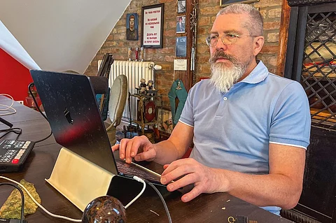 A photo taken on 27 May 2025, in Sremski Karlovci, shows Igor Grishin former Russian citizen who is waiting for Serbian citizenship, at his family home. More than 20 Russians and Belarusians residing in Serbia have become "stateless" after renouncing their original citizenships but were not granted the Serbian nationality they had applied for. Most have lived in Serbia for over a decade — buying property, starting businesses, and raising children born in the country — where they are now basically trapped, unable to leave. Six months to two years — depending on the case — after giving up their original nationality, none has received a clear explanation from Serbian authorities for the delay.