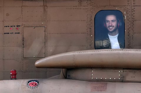 (FILES) NEWLY-released Israeli hostages Omer Shem Tov sits in an Israeli Air Force CH-53 military transport helicopter arriving at Beilinson Hospital in the Rabin Medical Centre in Petah Tikva in central Israel on 22 February 2025. Three more Israeli hostages were freed by Hamas militants at a ceremony in central Gaza on February 22 after two others were released in the southern part of the Palestinian territory.
