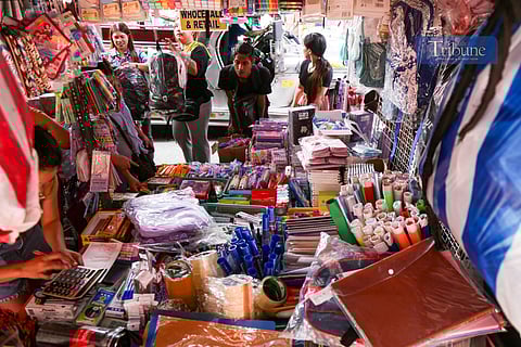Thrift shops along the sidewalks of Baclaran in Parañaque City sell school supplies in this photo taken on the morning of 1 June 2025. The Department of Trade and Industry has released a price guide showing a slight drop in prices of most school supplies, with reductions ranging from P1 to P10.