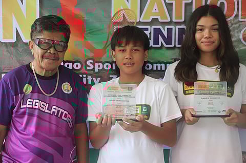 IZABELLE Camcam (right) and Tyronne Caro show their trophies after impressive performances in the Governor’s Cup in Pagadian City. Also shown is Zamboanga del Sur sports coordinator Alfred Cimafranca.