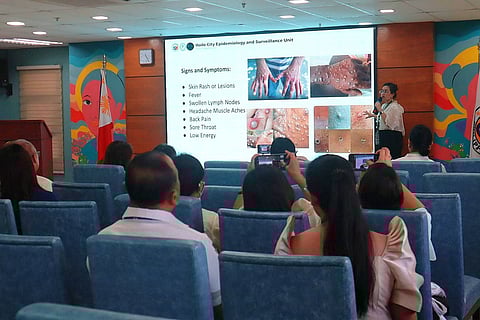 A member of the Iloilo City Health Office speaks to City Hall department heads during a briefing as part of the ongoing collective efforts toward the prevention and containment of monkeypox.