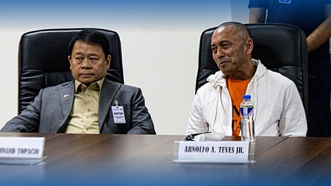 Former Negros Oriental Rep. Arnie Teves answers media questions with counsel Atty. Ferdinand Topacio during a press conference at NBI headquarters in Pasay City.