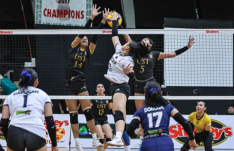 CRIS Navarra of NUNS attacks the defense of Nicole Pelaez and Ryzal Laag of UST during their 25-14, 25-23 victory in the 2025 Shakey’s Girls Volleyball Invitational League Rising Stars Cup Division 1 on Tuesday at the La Salle Green Hills Gym.