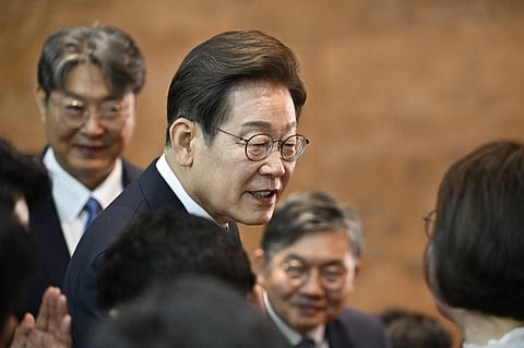 South Korea's President Lee Jae-myung talks to attendees during the conclusion of his inauguration ceremony at the National Assembly in Seoul on 4 June 2025.