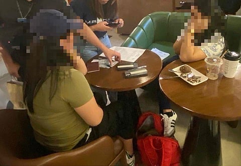 THE two alleged extortionists who were collared in a combined entrapment operation of the Bureau of Customs and the National Bureau of Investigation at Maku Coffee in Ermita, Manila.