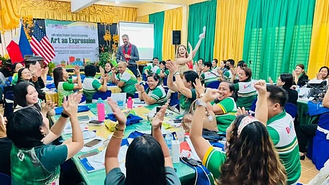ENGLISH language specialists Shélynn Riel and Joe Voigts facilitate a session on using art as a medium for student engagement and effective communication.