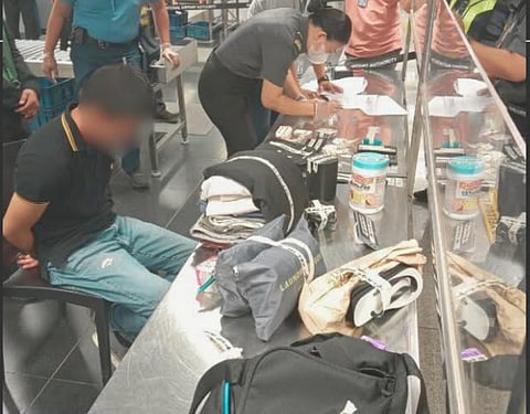 OFFICE for Transportation Security personnel at NAIA Terminal 3 conduct manual inspection of a passenger’s backpack