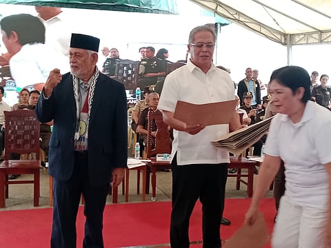 BuCor Director General Gregorio Catapang Jr. distribute the certificate of release to the NBP persons deprived of liberty at National Bilibid Prison on Wednesday.