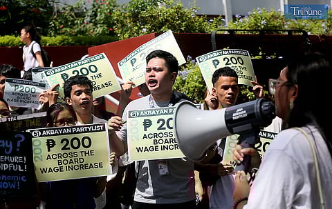 HUNDREDS of students join a solidarity walk organized by Akbayan Partylist for workers' rights at the University of the Philippines Diliman in Quezon City on Wednesday, 30 April 2025, vowing support for the passage of a P200 minimum wage hike, ahead of the Labor Day celebration.