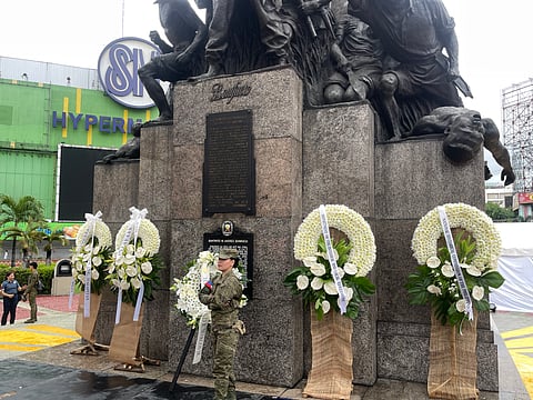 A PHILIPPINE Army soldier stands solemnly beside wreaths laid at the statue of Andres Bonifacio in Monumento Circle during the Independence Day celebration on Thursday, 12 June 2025.
