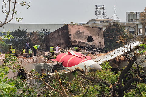AN investigation team inspects the wreckage of Air India flight 171 a day after it crashed in a residential area near the airport, in Ahmedabad on June 13, 2025. Investigators recovered a black box recorder from the crash site on June 13 of a London-bound passenger jet that ploughed into a residential area of India's Ahmedabad city, killing at least 265 people on board and on the ground.