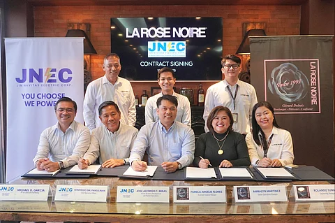 At the power deal signing are (standing, from left) Rolando Tungol, La Rose Engineering manager; Neo Jade de Guzman, JNEC Retail Operations manager; Arnel Elizalde, La Rose Admin manager and (seated, from left) Michael Garcia, JNEC VP for sales and marketing; Winifredo Pangilinan, JNEC chief operating officer; Jose Alfonso Miras, JNEC VP for business development and market operations; Pamela Angelie Flores, La Rose assistant general manager; and Annalyn Martinez, La Rose senior operations manager.