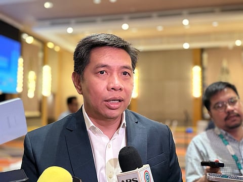 DICT Secretary Henry R. Aguda speaks to reporters at the sidelines of the Economic Journalists Association of the Philippines on 16 June.