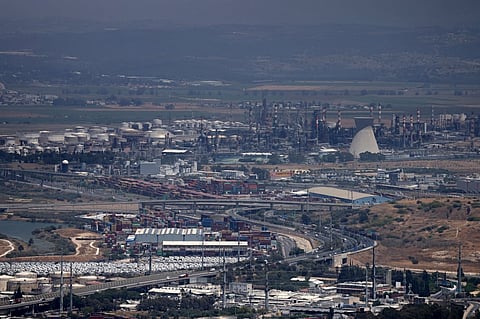 This picture shows a view of the oil refinery in the Israeli city of Haifa on June 15, 2025, after it was reportedly damaged in the overnight Iranian missile attack. Iranians and Israelis woke to smoke and rubble on June 15, after the arch-rivals expanded their attacks overnight, with Israel striking Tehran's defence ministry, and Iran unleashing a deadly barrage of missiles.