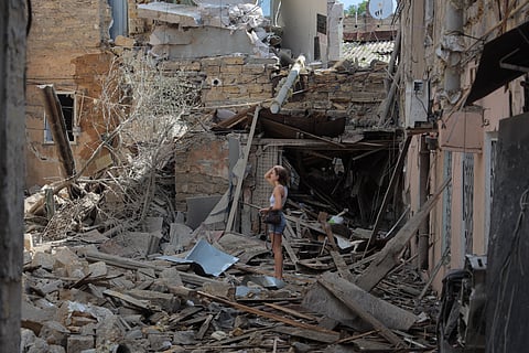 LOCAL residents inspect the aftermath of a drone strike in Odesa on 17 June 2025, as Ukraine condemns the world’s lack of “adequate reaction” to Russia’s deadly attacks, including the strike on Kyiv that killed at least 14.