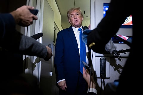 US President Donald Trump speaks to reporters about the G7 Summit aboard Air Force One while travelling back to Washington from Canada on June 16, 2025. US President Donald Trump left a G7 summit in Canada a day early on June 16, heading back to the White House as Israel and Iran traded missile fire for a fifth straight day.