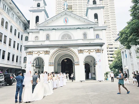A total of 93 couples tie the knot in free weddings organized by the local government of Manila.